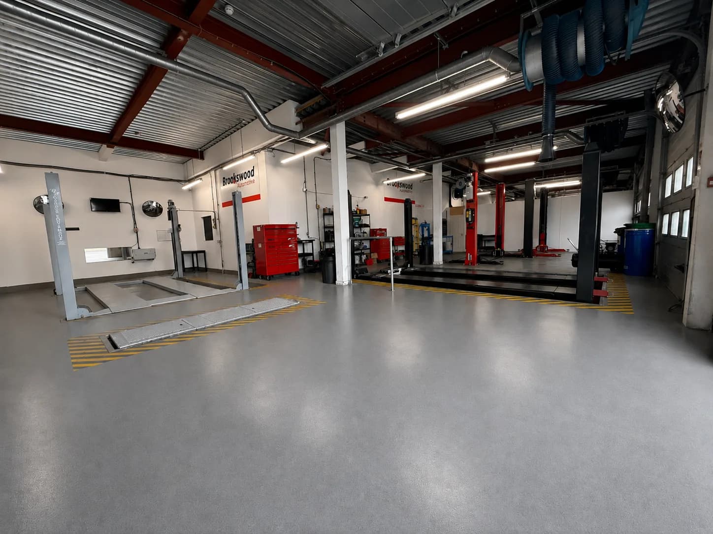The Brookswood Automotive workshop interior in Fareham, with vehicle lift bays and tool storage
