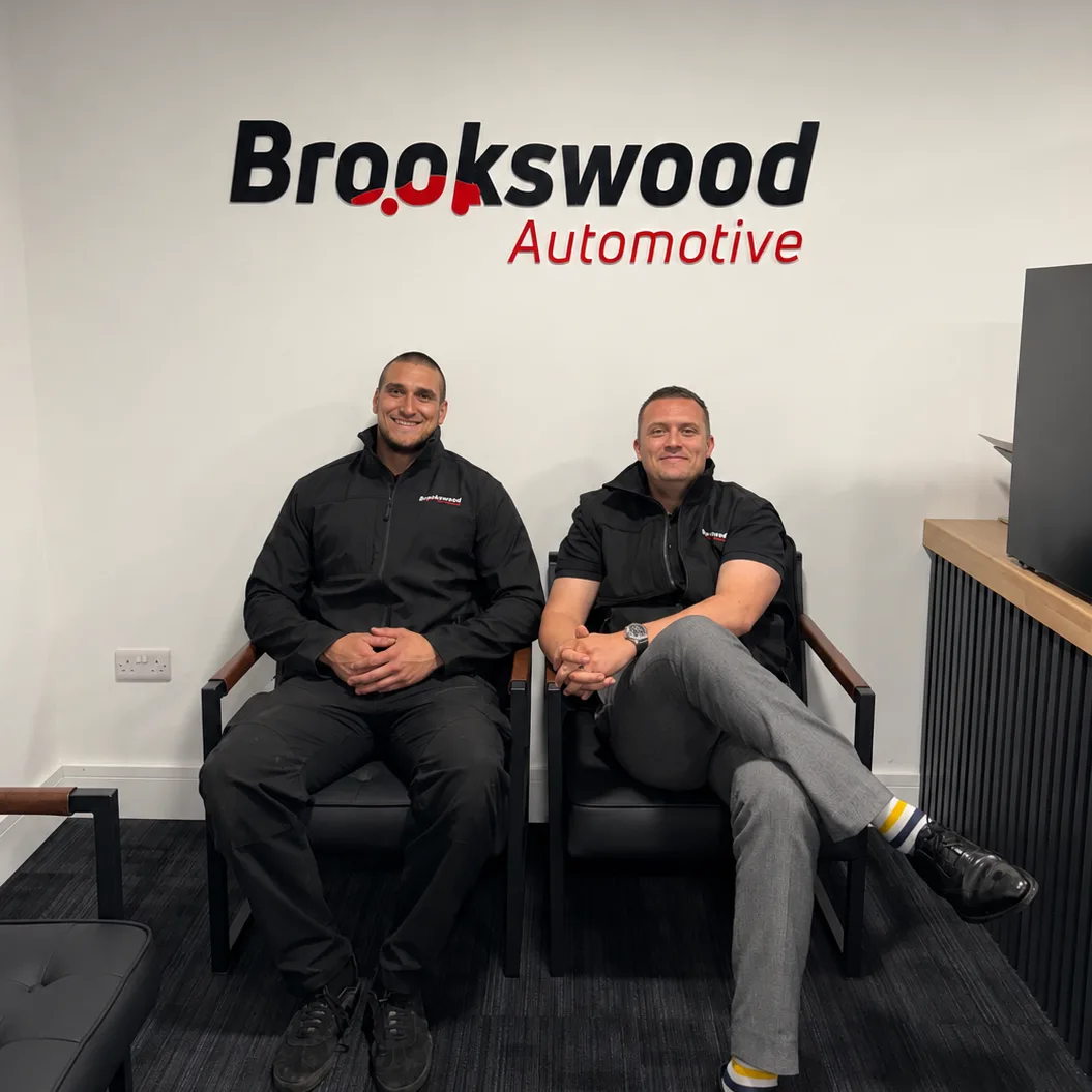 Two Brookswood Automotive team members seated in the reception area of the garage in Fareham